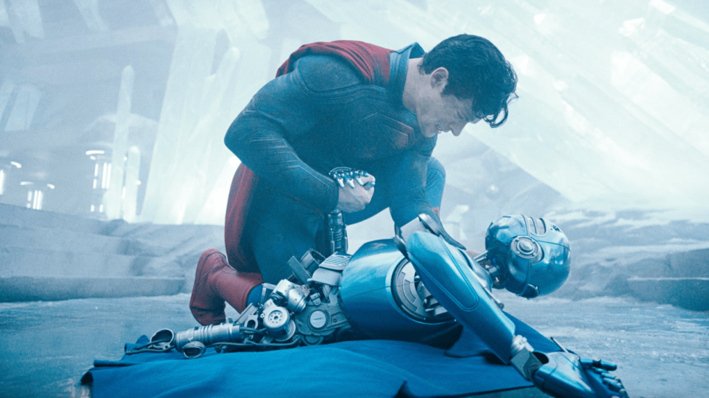 Superman with a destroyed robot from the Fortress of Solitude.