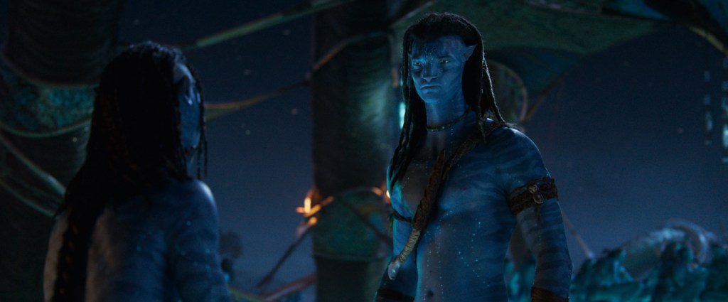 Britain Dalton as Lo’ak and Sam Worthington as Jake Sully in Avatar: Fire and Ash.