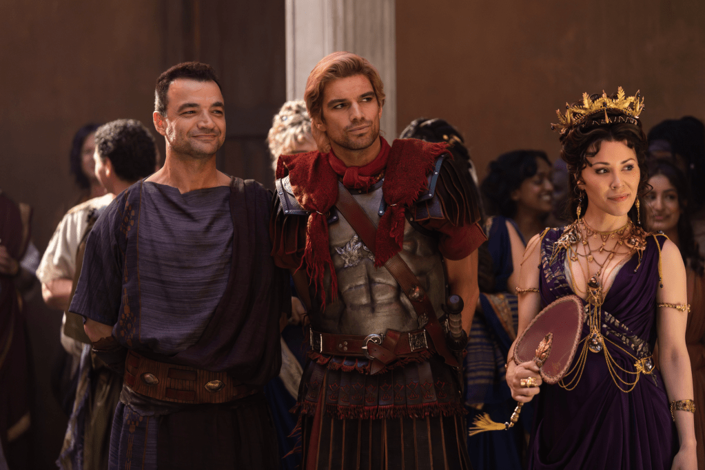 Nick E. Tarabay as Ashur, Jackson Gallagher as Julius Caesar, and Jaime Slater as Cornelia in Spartacus: House of Ashur.